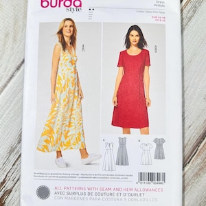 May include: A Burda Style sewing pattern packet featuring two dress designs. The packet includes images of the finished dresses, one with a yellow and white floral pattern and the other a solid red color. The pattern number is 6496.