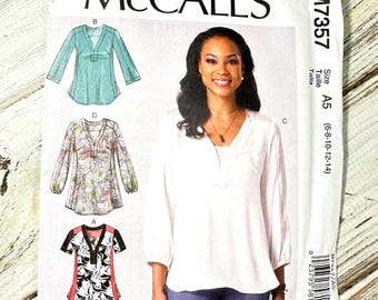 Women’s Shirt Sizes 6-14. Loose Top blouse pullover, short long sleeves side slits easy. Paper Sewing Pattern McCalls Misses. New Uncut 7357