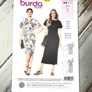 May include: A Burda Style sewing pattern package featuring illustrations of two dresses. The package includes the text "burda style" and "6439". The dress patterns are for sizes EUR 36-46 and US 10-20. The package also includes the text "ALL PATTERNS WITH SEAM AND HEM ALLOWANCES".