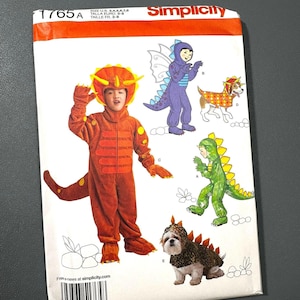 May include: Simplicity pattern 1765A showing dinosaur costumes for children and pets. The orange and brown costume has a tail and a hood with horns. Other costumes include a purple dragon, a green dinosaur, and a dog costume.