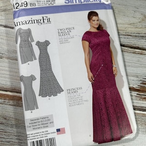 May include: Simplicity sewing pattern number 1249 for a two-piece dress with a raglan sleeve. The pattern is for sizes 20W-28W and features a burgundy dress with a princess seam. The pattern includes separate patterns for cup sizes B, C, D, and DD.