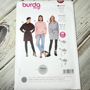 May include: A white sewing pattern package with the Burda Easy logo and the number 6074. The package features illustrations of three women wearing different shirt and dress designs. The text "Jersey Knits" is also visible.