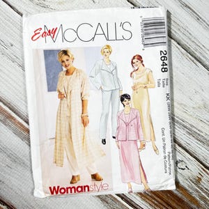 May include: A rustic wooden sign with the text "Welcome to our home" in white lettering. The sign features a distressed finish and a simple, inviting design, perfect for front door decor.