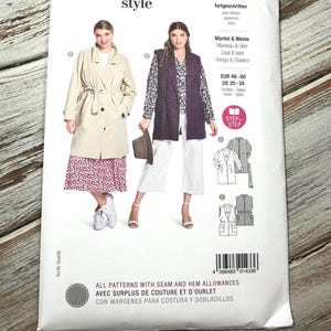 May include: A Burda Style sewing pattern packet featuring illustrations of a coat and vest. The packet includes the text "Mantel & Weste" and size information. The background is a light wood grain.