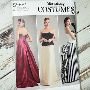 May include: Simplicity Costumes sewing pattern S9881. The pattern features three different formal dress designs. The size range is US 6-16. The cover shows a burgundy gown, a navy blue top with a cream skirt, and a black and white striped gown.