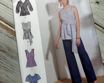 May include: Simplicity sewing pattern number S8921, size US 14-22, for a sleeveless top with a tie at the waist. The pattern includes four different styles of tops, with variations in sleeves, necklines, and fabric choices. The model is wearing a blue and white gingham top with a tie at the waist and blue jeans.