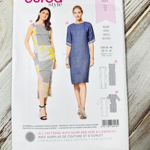 May include: A Burda Style sewing pattern featuring two dress designs. The pattern includes sizes EUR 36-46 and US 10-20. The cover displays images of the finished dresses, one with a black and white checkered pattern and the other a solid blue.