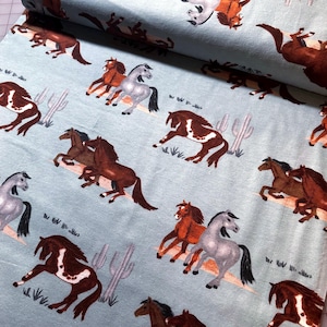 Horses in the Desert on aqua blue Super Snuggle Flannel Fabric. Joann Fabrics 100% cotton Brushed for softness. Rare OOP pony desert cactus