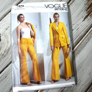 May include: Vogue Patterns sewing pattern 1870. The pattern features a yellow pantsuit with a blazer and flared pants. The pattern cover shows two women wearing the suit. The pattern size is Y5 (18-20-22-24-26).