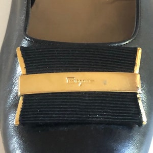 Ferragamo vintage black leather pumps with gold finishes by Ferragamo