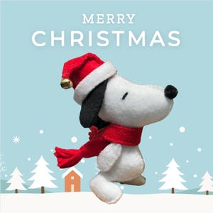 May include: A white felt plush toy dog wearing a red Santa hat and a red scarf. The dog is standing on a snowy background with the words "Merry Christmas" at the top of the image.
