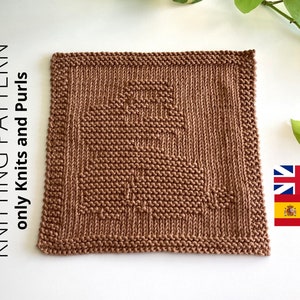 May include: A brown knitted dishcloth with a geometric pattern. The dishcloth is made with only knit and purl stitches.