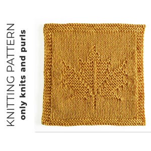 May include: A square mustard yellow knitted swatch featuring a central maple leaf design created with knit and purl stitches. The text KNITTING PATTERN only knits and purls is printed vertically in black on the left side of the image.