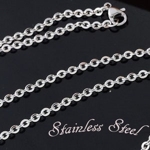 May include: A silver chain necklace made of stainless steel. The chain is a simple, classic design with oval links.