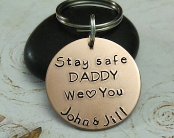 May include: Copper keychain with the text "Stay safe Daddy We ♥ You John & Jill" engraved on it.