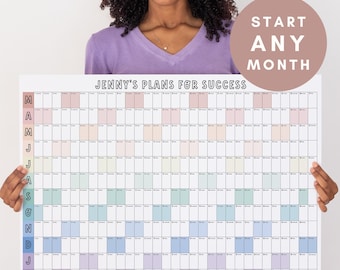 May include: A large wall calendar titled Jenny's Plans for Success with a grid layout for twelve months. The left column lists months with initials, and the grid features alternating pastel colored blocks for days. A circular badge reads Start Any Month.