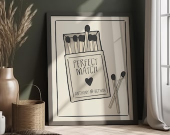 May include: A black and white illustration of a matchbox with the text "Perfect Match" and the names "Anthony & Bethan". The matchbox is filled with matches and there are two matches sticking out of the box.