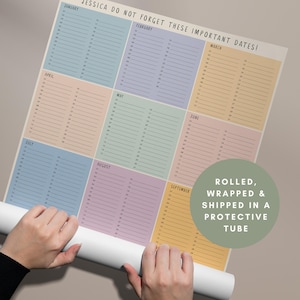 May include: A personalized calendar with pastel-colored monthly sections. The calendar is titled "JESSICA DO NOT FORGET THESE IMPORTANT DATES!" and is rolled up. The calendar is designed to help keep track of important dates.