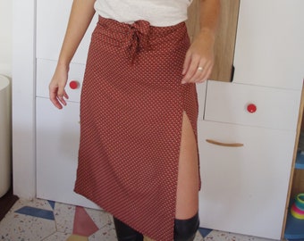 Long printed slit skirt with a belt