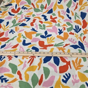 double gauze primary color geometric and abstract palm patterns. Fabric for clothmaking. Soft cotton woven