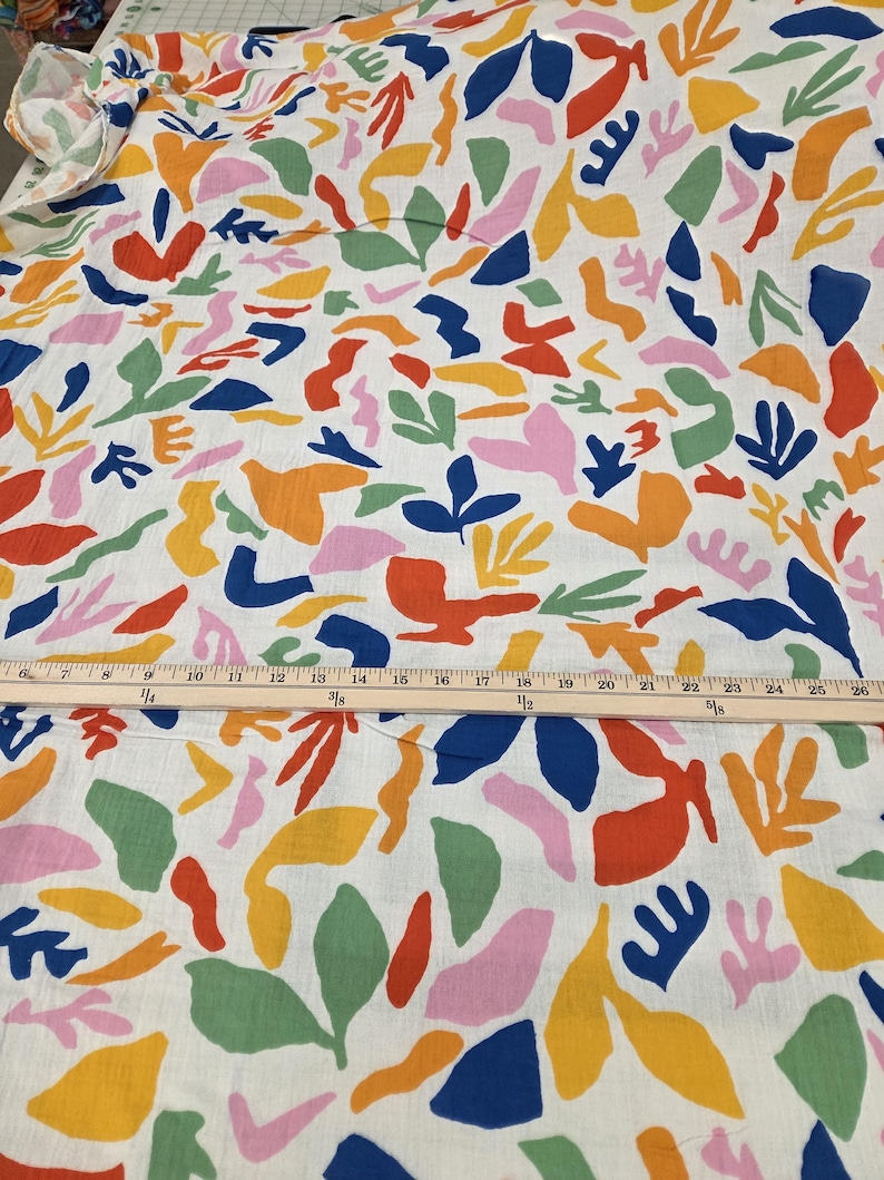 double gauze primary color geometric and abstract palm patterns. Fabric for clothmaking. Soft cotton woven