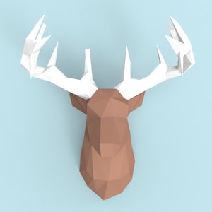 May include: A brown paper deer head with white paper antlers. The deer head is made of folded paper and has a geometric design.