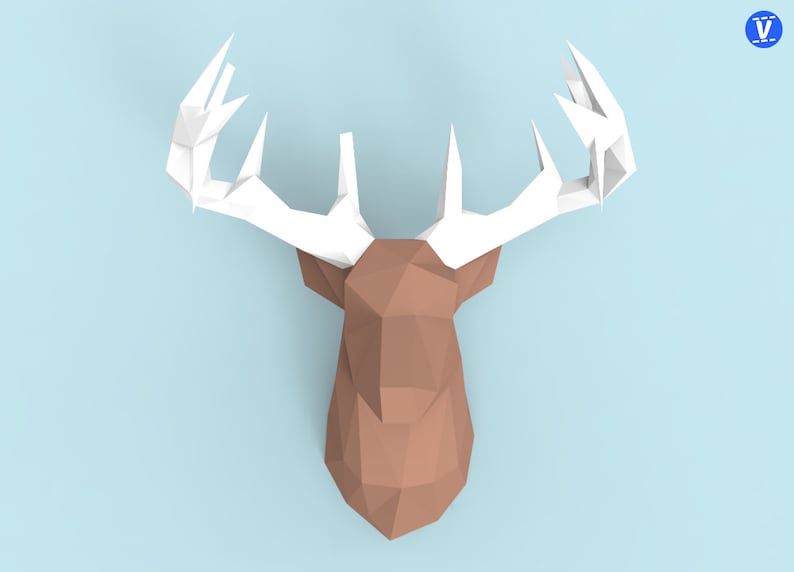 May include: A brown paper deer head with white paper antlers. The deer head is made of folded paper and has a geometric design.