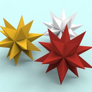 May include: Three paper stars, one red, one yellow, and one white, are arranged on a light blue background.