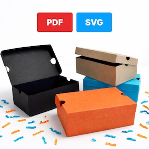 May include: An assortment of shoe boxes in various colors, including black, orange, and blue, are displayed. One black box is open, revealing the interior. The image also features the text "PDF" and "SVG" on red and blue backgrounds, respectively.