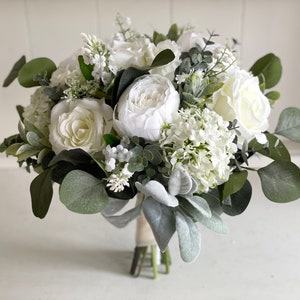 Elegant white and sage green silk wedding flowers.