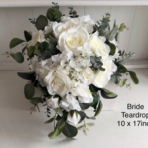 Roses, hydrangea and eucalyptus silk wedding bouquet. White wedding flowers