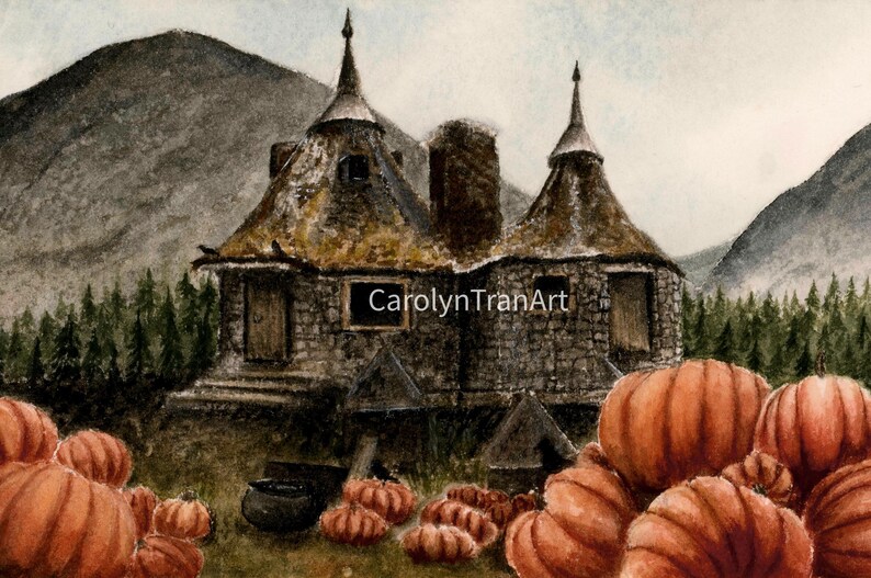 May include: A watercolor painting of a stone cottage with two conical roofs nestled in a forest with mountains in the background. A large patch of orange pumpkins sits in the foreground. The text CarolynTranArt is visible on the cottage.