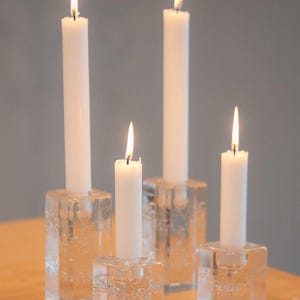détail flamme bougie blanche paraffine ambiance lumineuse