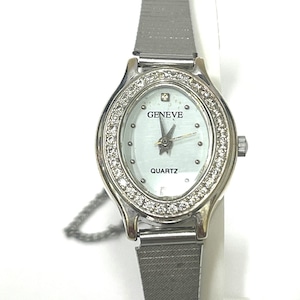 Ladies vintage 18K white gold Geneve oval shaped quartz movement watch set with round diamonds and mesh type stainless steel band. image 1