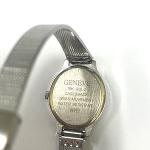 Ladies vintage 18K white gold Geneve oval shaped quartz movement watch set with round diamonds and mesh type stainless steel band. image 5