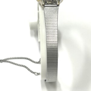 Ladies vintage 18K white gold Geneve oval shaped quartz movement watch set with round diamonds and mesh type stainless steel band. image 3