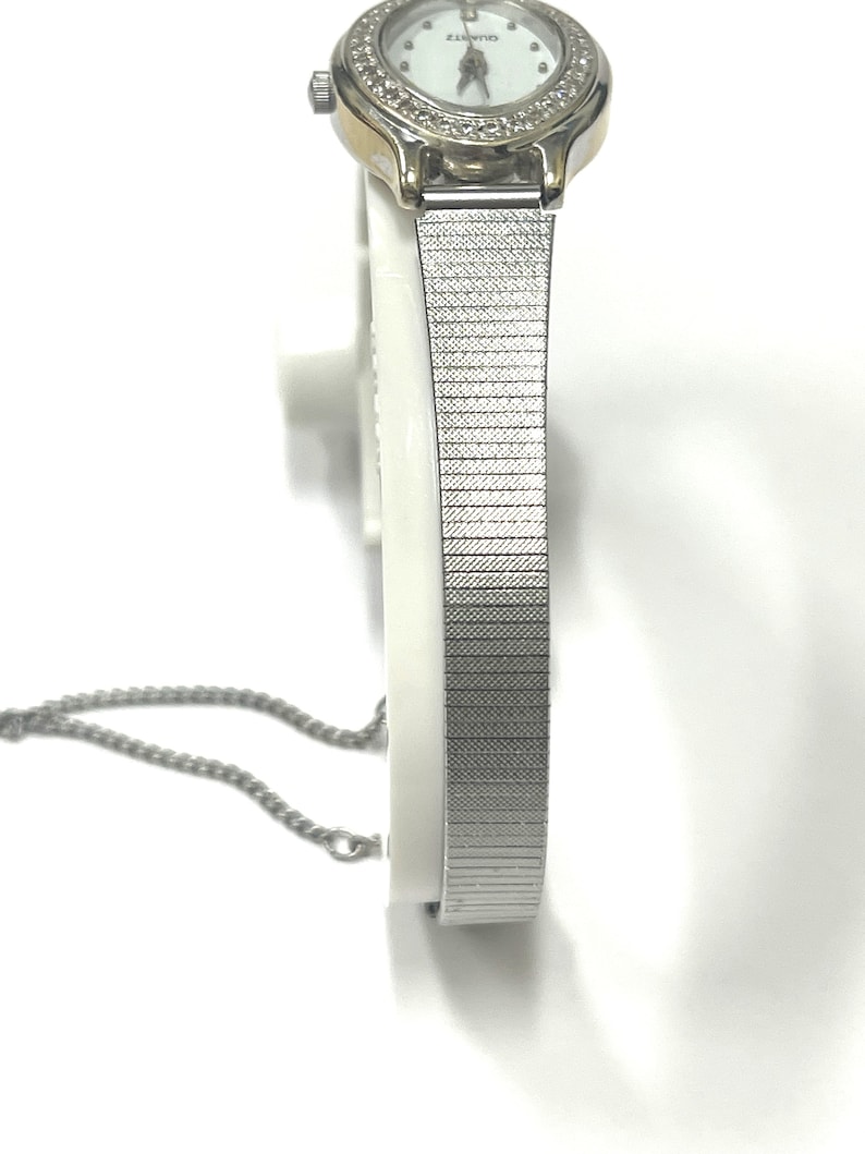 Ladies vintage 18K white gold Geneve oval shaped quartz movement watch set with round diamonds and mesh type stainless steel band. image 3