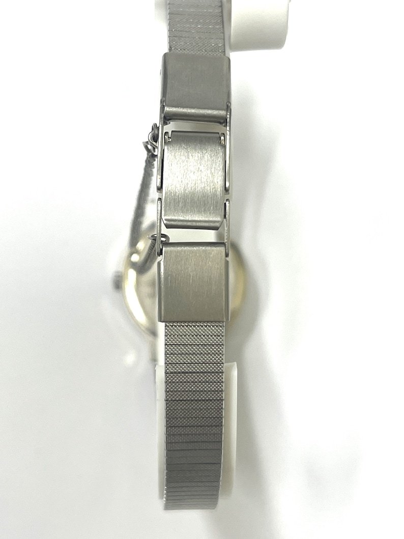 Ladies vintage 18K white gold Geneve oval shaped quartz movement watch set with round diamonds and mesh type stainless steel band. image 6
