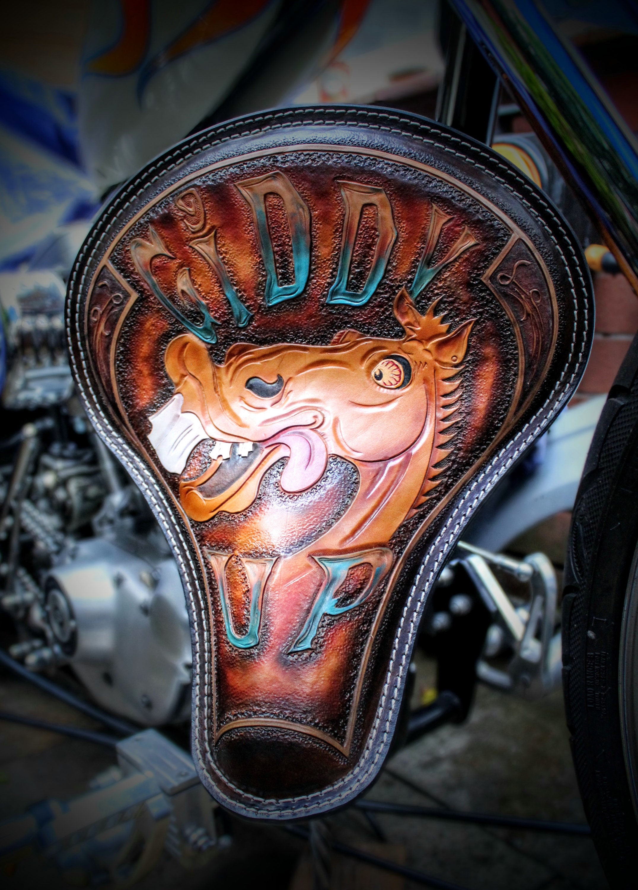 A handcrafted chopper seat with intricate stitching and a rich, aged leather finish, designed for riders who demand both performance and artistry.