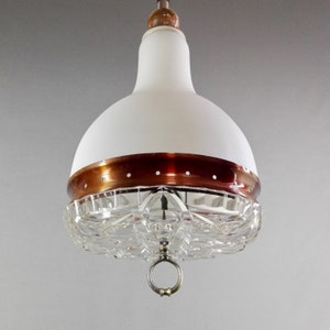 Italian rise-and-fall 1960s glass and aluminium three-light pendant lamp.