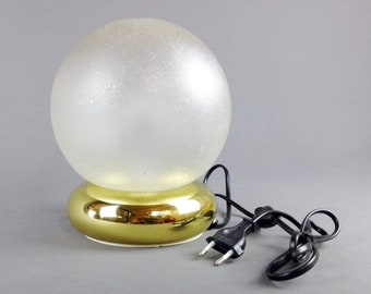 1980s Targetti table/bedside lamp. Gilded metal base. Murano glass bowl.