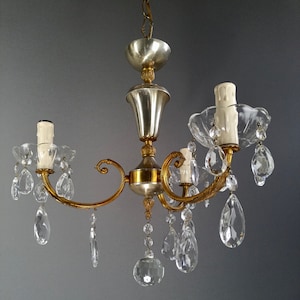 Italian 1950s crystal brass and aluminium three-light chandelier.