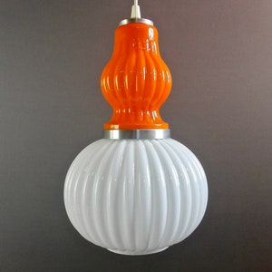 Italian Murano glass 1960s two-tone white and orange-red pendant lamp with aluminum frame.
