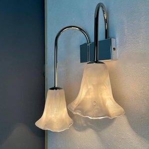 La Murrina Murano. Pair of two-light wall lamps in hand-worked art glass and chrome frames. Italy, 1990s.