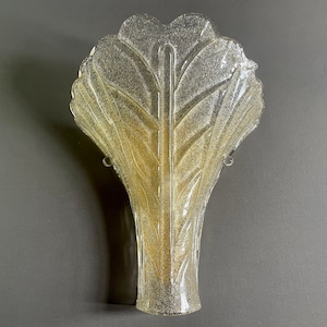 Large Murano art glass 1990s one-light sconce in the style of Barovier and Toso. Amber-colored Graniglia and gilt metal frame.