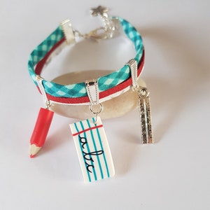 pulsera maestra de regalo, pulsera escuela, rojo, plata, turquesa, página de escritura, lápiz, regla