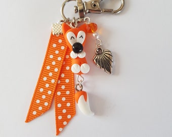 bijou de sac renard,cadeau renard original,renard qui bouge la queue,orange et blanc,idée cadeau noël