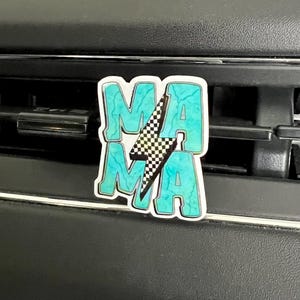 May include: A turquoise blue car air freshener with the word "MAMA" in white letters and a black and white checkered lightning bolt design.