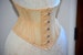 Real steel boned underbust underwear corset from transparent mesh and cotton. Summer waist training corset for tight lacing of nude color 