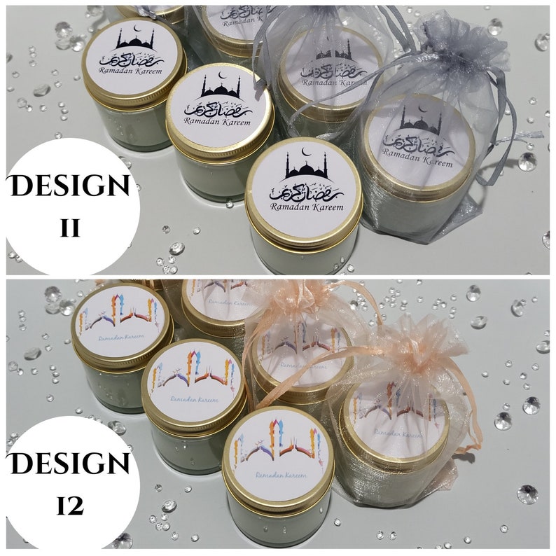 May include: Two different designs of small, green glass candle jars with gold lids. The jars are decorated with white labels that say "Ramadan Kareem" in Arabic script and English. The candles are displayed on a white surface with small, clear decorative stones.